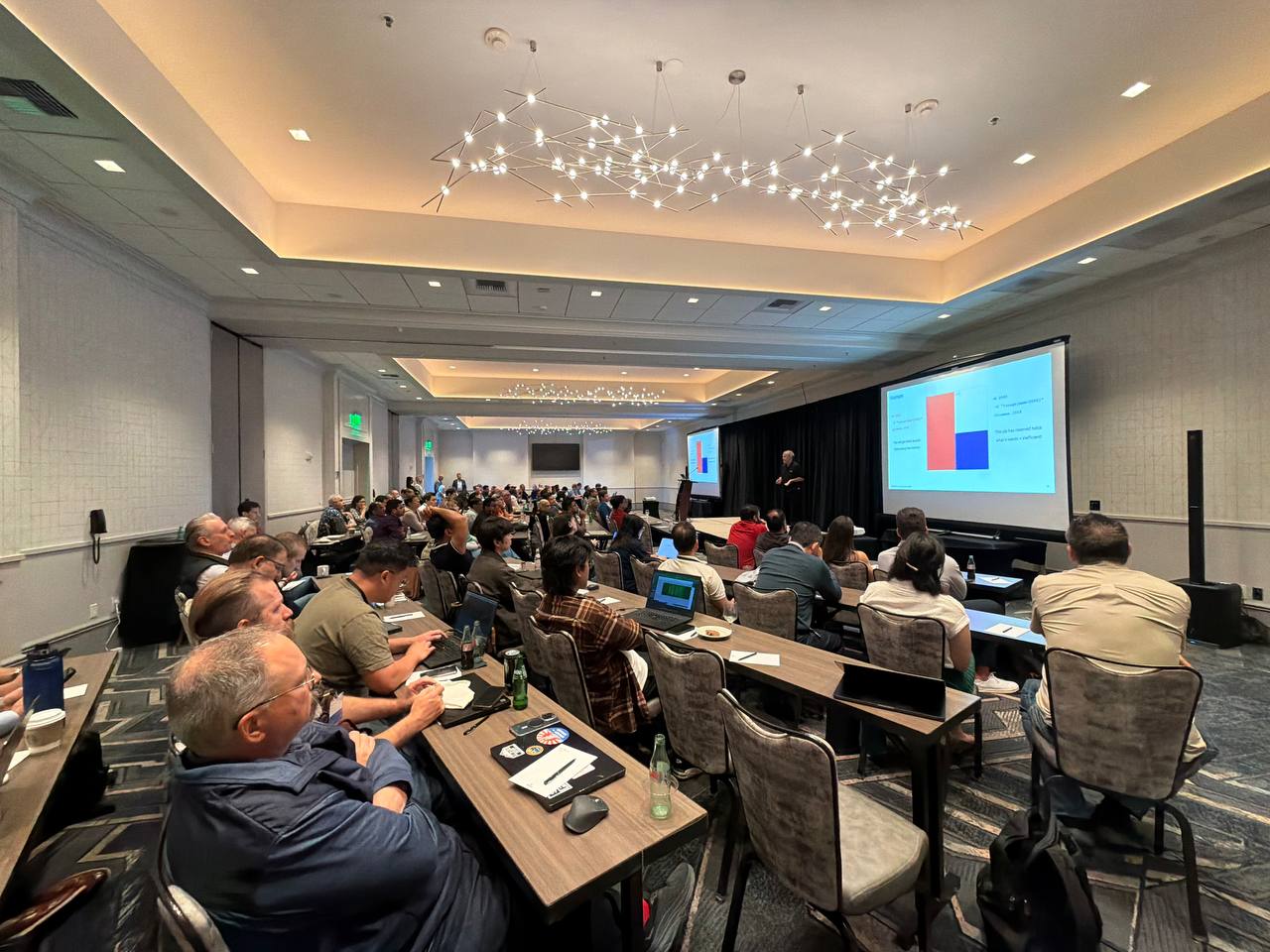 Audience attending an LSF conference session in a hotel conference room