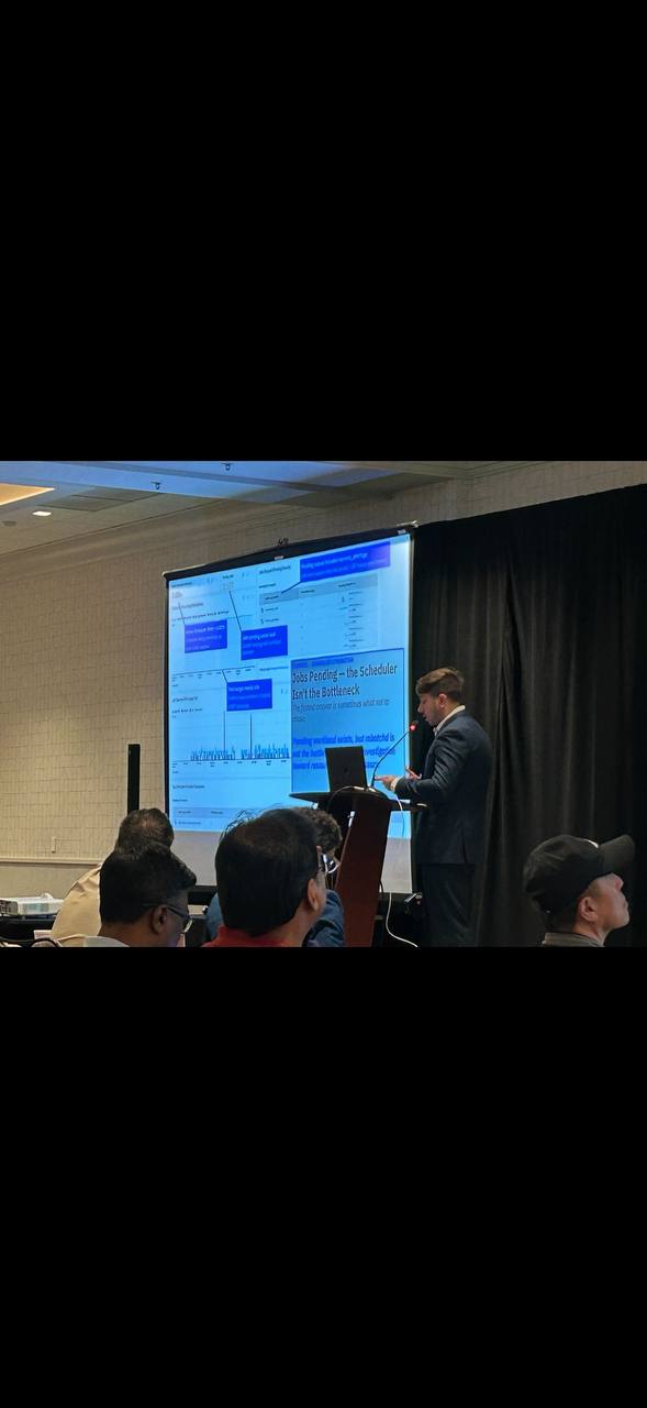 Alejandro Palumbo speaking at a podium during an LSF conference session